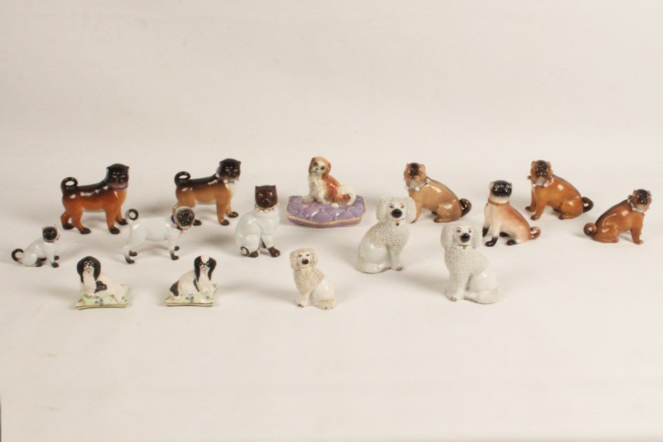 GROUP OF 15 PORCELAIN AND STAFFORDSHIRE FIGURES OF DOGS: GROUP OF 15 PORCELAIN AND STAFFORDSHIRE FIGURES OF DOGS; 4.5"H TALLEST