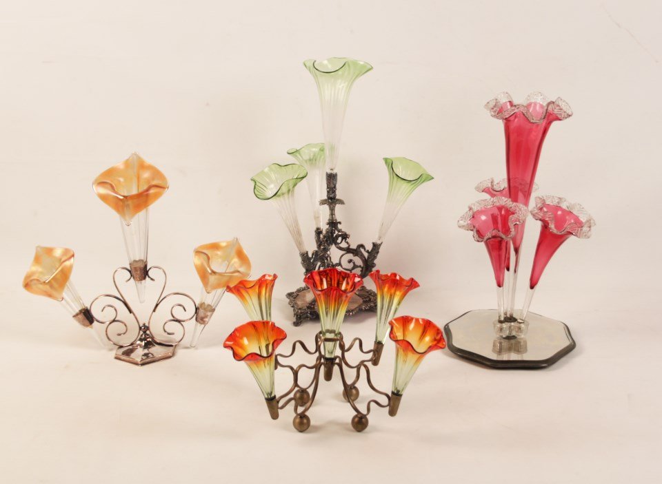 4 MISCELLANEOUS VICTORIAN EPERGNES: 4 MISCELLANEOUS VICTORIAN EPERGNES INCLUDING A 4 FLUTED CRANBERRY TRUMPET EPERGNE WITH A MIRRORED PLATEAU BASE, A 4 TRUMPET CLEAR TO GREEN GLASS EPERGNE ON A REGENCY STYLE SILVER STAND WITH GRIFFIN HE