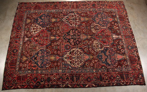 ORIENTAL RUG 9'4" X 12'2" BAKHTIARI: ORIENTAL RUG 9'4" X 12'2" BAKHTIARI; CONDITION: SCATTERED DYE LOSS