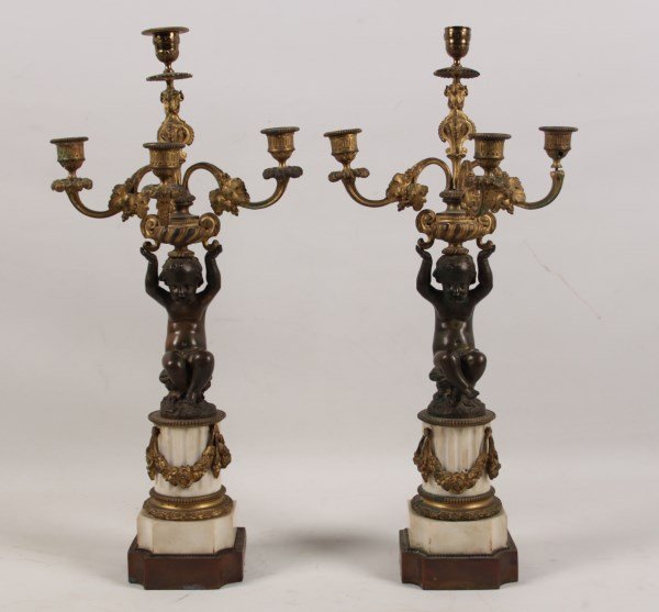 PAIR OF FRENCH 4 LIGHT CANDELABRA: PAIR OF FRENCH 4 LIGHT CANDELABRA WITH PUTTI SURMOUNTS ON FLUTED WHITE MARBLE COLUMNS ADORNED WITH GILT BRONZE SWAGS; 22"H; CONDITION: DRILLED AT ONE TIME FOR ELECTRICITY