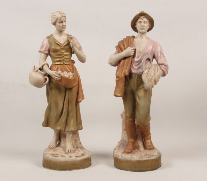 PAIR OF ROYAL DUX PORCELAIN FIGURES OF PEASANTS: PAIR OF ROYAL DUX PORCELAIN FIGURES OF PEASANTS, MARKED ON THE REVERSE IN RED "CZECHOSLOVAKIA" WITH PINK TRIANGLE READING "ROYAL DUX BOHEMIA", LATE 19TH/20TH C.; 20.5"H