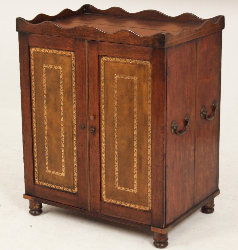 COUNTRY ENGLISH OAK FITTED CABINET: COUNTRY ENGLISH OAK FITTED 2 DOOR CABINET WITH TOOLED LEATHER PANEL DOOR, 19TH C.; 37"H X 30"W X 21.5"D
