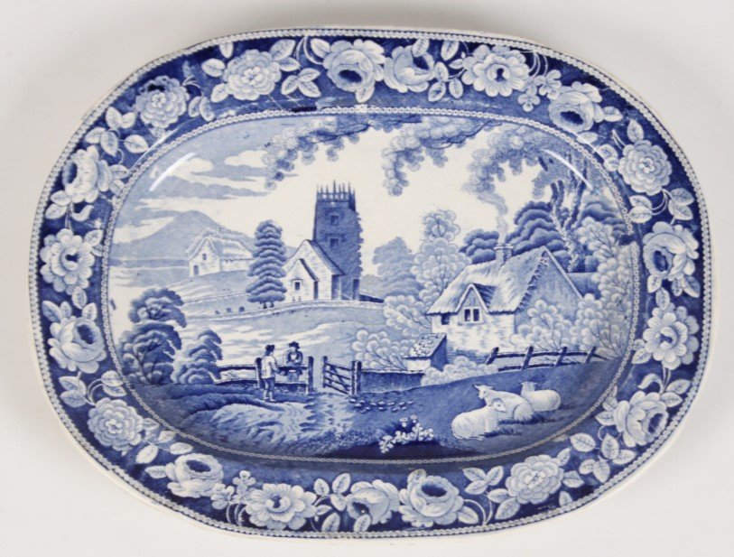 LARGE 18.5" BLUE AND WHITE STAFFORDSHIRE PORCELAIN: LARGE 18.5" BLUE AND WHITE STAFFORDSHIRE OVAL PORCELAIN PLATTER DEPICTING ENGLISH COUNTRYSIDE, LATE 19TH C.; 14.25"H X 18.5"W X 1.75"D