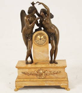 LARGE FRENCH JAUNE MARBLE AND DORE BRONZE MOUNTED CLOCK: LARGE FRENCH JAUNE MARBLE AND DORE BRONZE MOUNTED CLOCK HAVING WINGED BRONZE MYTHOLOGICAL FIGURE MOUNTS, DIAL MARKED "RINGUET A PARIS"; 31"H X 20"W X 9"D