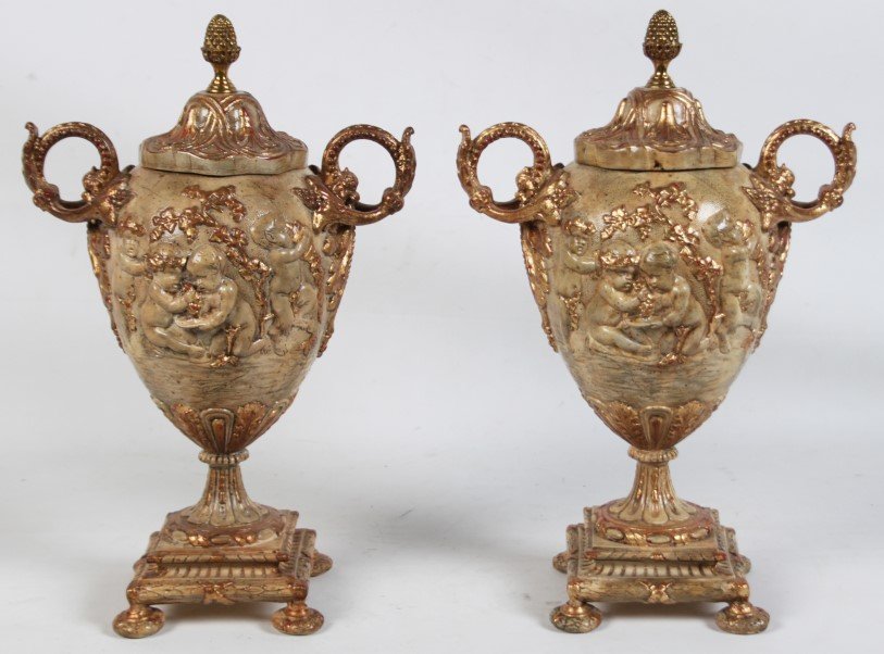 PAIR OF DECORATIVE PAINTED URNS WITH EMBOSSED CUPID: PAIR OF DECORATIVE PAINTED URNS WITH EMBOSSED CUPID DESIGN; 17"H
