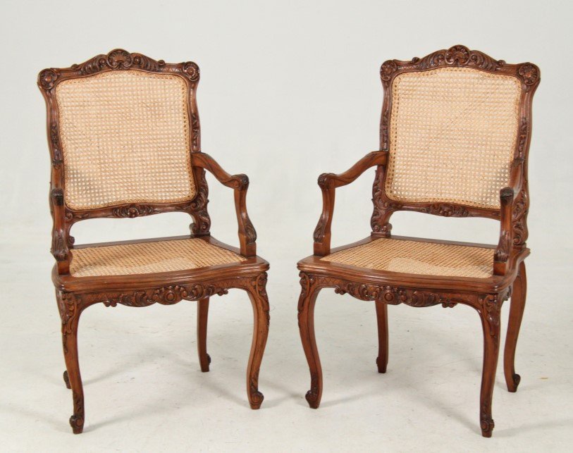 PAIR OF LOUIS XV STYLE CARVED WALNUT FAUTEUILS: PAIR OF LOUIS XV STYLE CARVED WALNUT FAUTEUILS WITH CANE BACK AND SEAT; 41"H X 24"W X 18"D