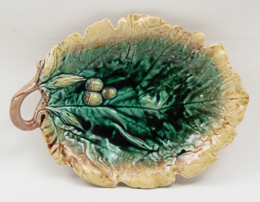 FRENCH MAJOLICA LEAF SHAPE DISH: FRENCH JAUNE AND VERDE MAJOLICA LEAF SHAPE DISH HAVING VINE FORM HANDLE, LATE 19TH C.; 2"H X 11.5"W X 8.5"D