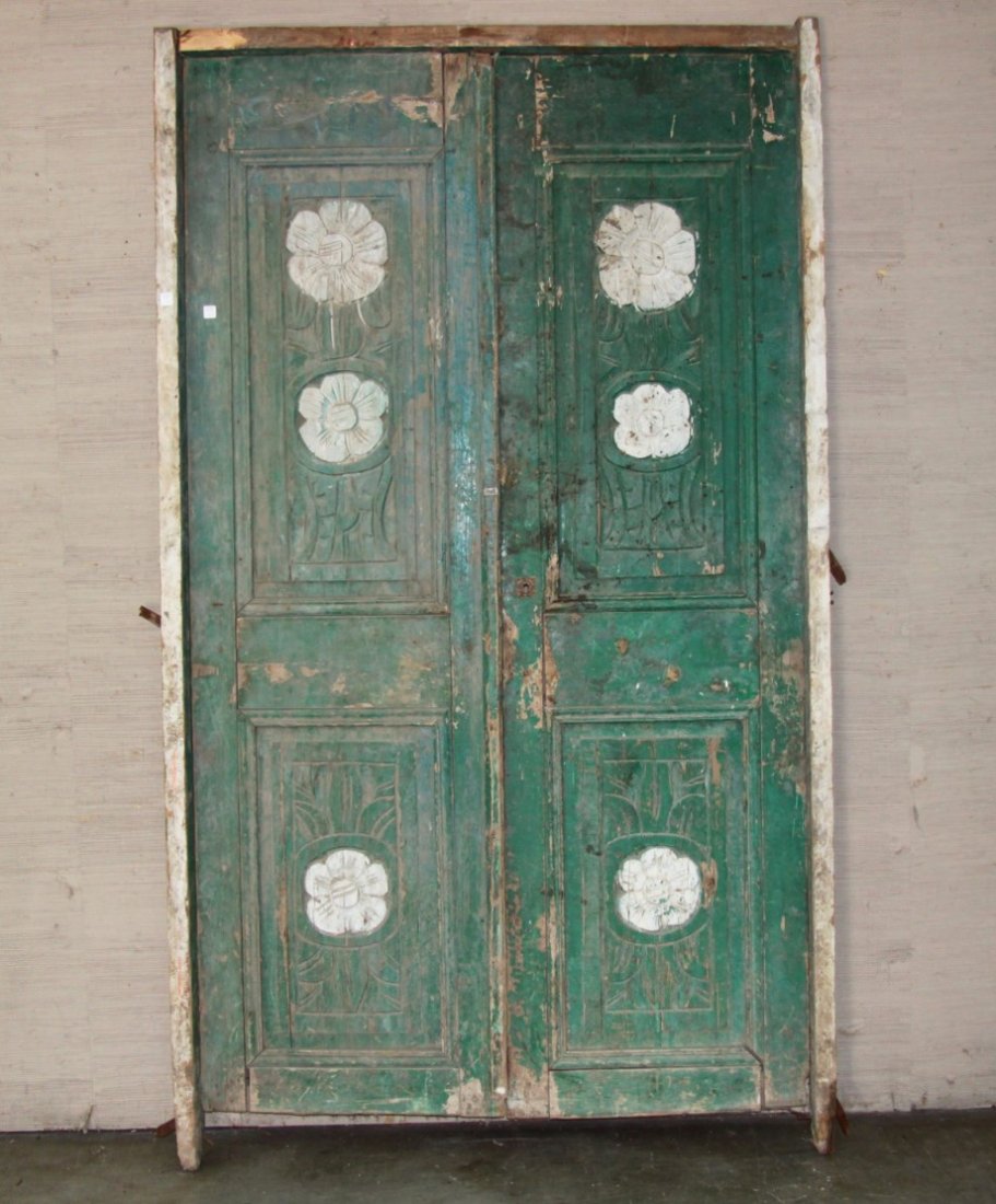 PAIR OF FRAMED FLORA CARVED WOOD DOORS: PAIR OF FRAMED FLORA CARVED SQUARE PEGGED WOOD DOORS; 7'4" X 4'3"