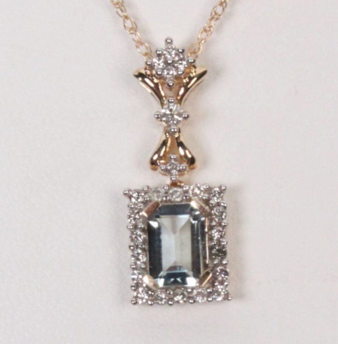 14K AQUAMARINE AND DIAMOND NECKLACE: 14K YELLOW GOLD AQUAMARINE AND DIAMOND NECKLACE HAVING 0.26 CTW DAIMONDS, 7MM X 5MM AQUAMARINE