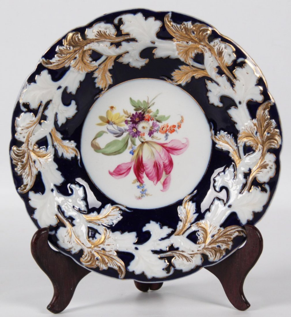 MEISSEN PORCELAIN 10" BOWL: MEISSEN PORCELAIN COBALT AND GOLD HIGHLIGHTED RAISED FLORAL DECORATED SHAPED 10" BOWL WITH PAINTED CENTER RESERVES; 10"DIA.