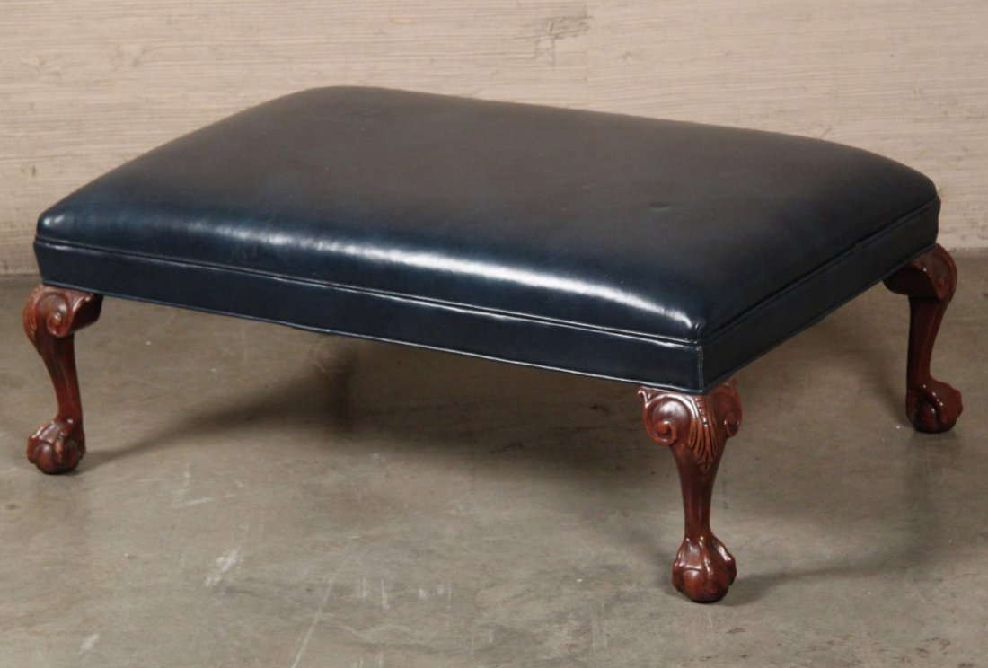 BLUE LEATHER OTTOMAN: BLUE LEATHER OTTOMAN ON ANCANTHUS CARVED BALL AND CLAW LEGS; 15"H X 38"W X 26"D