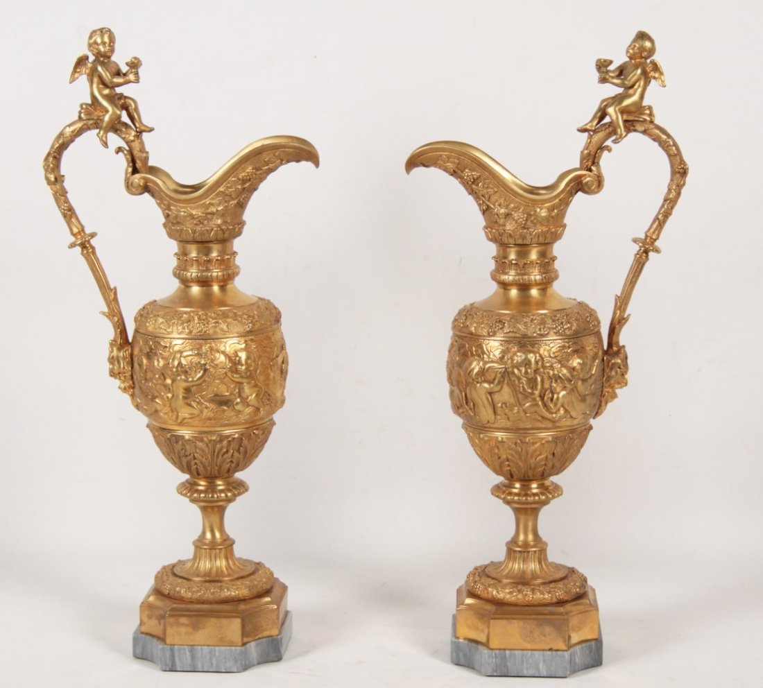 PAIR OF FRENCH DORE BRONZE PUTTI MOUNTED EWERS (1 of 3)