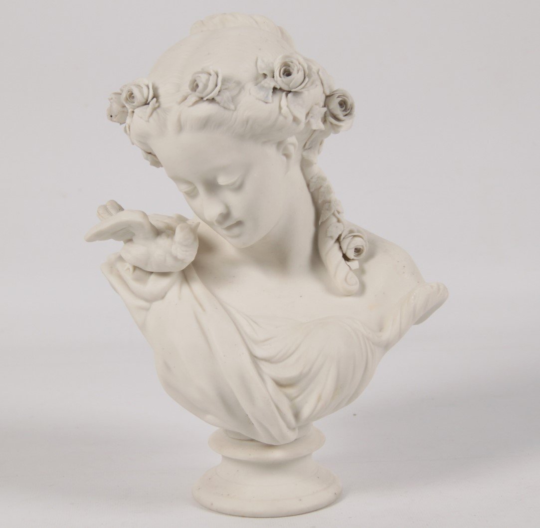 FRENCH BLANC DE CHENE UNGLAZED PORCELAIN BUST: FRENCH BLANC DE CHENE UNGLAZED PORCELAIN BUST OF BEAUTIFUL YOUNG WOMAN WITH DOVE PERCHED ON HER SHOULDER; 11"H X 8"W
