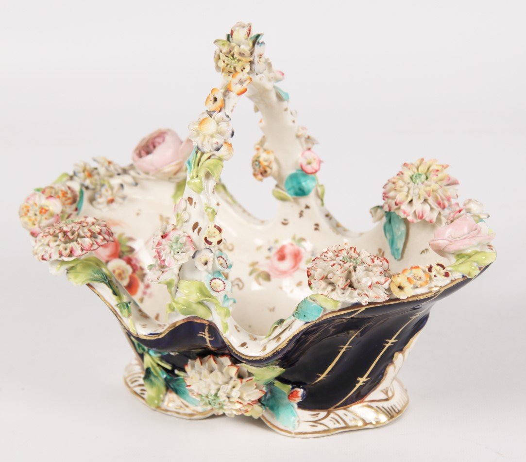 ENGLISH COLBROOKDALE PORCELAIN BASKET: ENGLISH COALBROOKDALE PORCELAIN HANDLED DOUBLE LOBED SHAPED BASKET HAVING COBALT GROUND EXTERIOR WITH VERTICAL GOLD VEIN LINES ADORNED WITH RAISED FLORAL RESERVES AND VINES ON A WHITE AND GOLD GILT CO