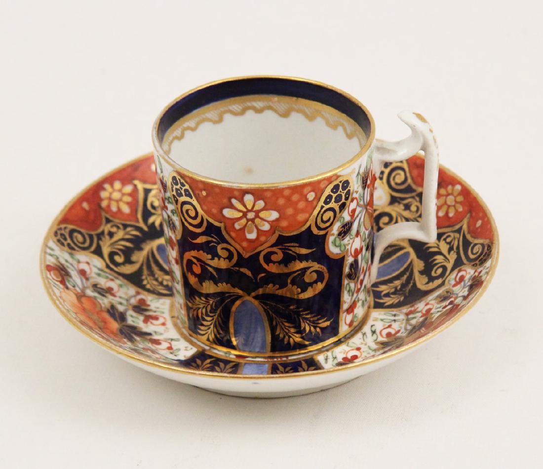 EARLY DERBY COFFEE CAN AND SAUCER: EARLY DERBY COFFEE CAN AND SAUCER MARKED WITH IRON RED CROWN UNDERGLAZE (LOSS TO BATONS), EARLY 19TH C.