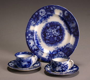Group of Five August Nowotny & Co. Flow Blue Table A: Group of Five August Nowotny & Co. Flow Blue Table Articles Consisting of a pair of cups, a pair of salad plates and a 'Bouquet' platter. Chips to rim of one cup. Diameter of platter: 8-3/8 in