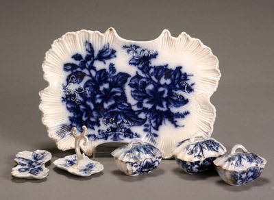 Flow Blue 'Azalia' Six-Piece Vanity Set Probably by: Flow Blue 'Azalia' Six-Piece Vanity Set Probably by James Kent Consisting of three covered boxes, a pin tray, a ring tray and a large tray. Length of tray: 12-5/8 in