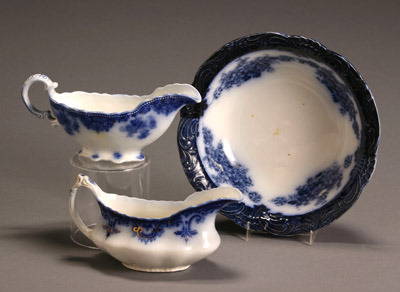 Two W. H. Grindley & Co. Flow Blue Gravy Boats and: Two W. H. Grindley & Co. Flow Blue Gravy Boats and a Wood & Son 'Victoria' Bowl The first gravy boat 'Osbourne', the second 'Clifton'. Length of largest gravy boat: 9 in; Diameter of bowl: 10-1/4 in