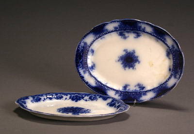 Flow Blue Alfred Meakin 'Kelvin' Platter and a W. &: Flow Blue Alfred Meakin 'Kelvin' Platter and a W. & E. Corn 'Mikado' Platter Two rim chips to underside of 'Kelvin' platter; small chip to rim of 'Mikado' platter. Length of largest: 14 in