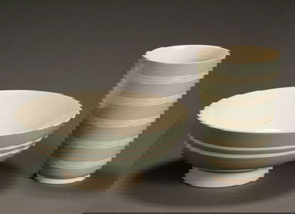 Two Keith Murray Wedgwood Celadon Table Articles A: Two Keith Murray Wedgwood Celadon Table Articles After 1940 The first, a cylindrical vase with incised concentric bands; the second, a circular bowl with two incised bands. The first with printed facs