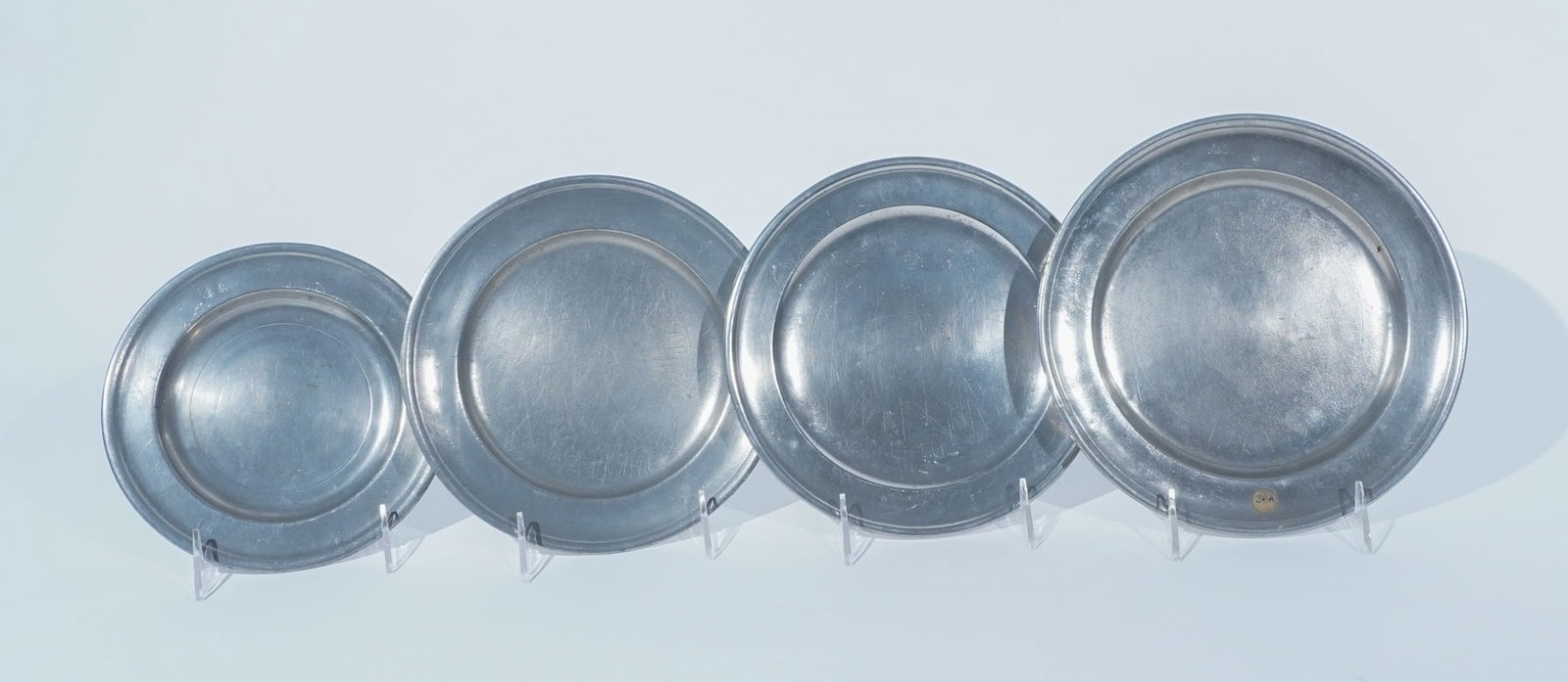 Assembled Set of Fifteen Predominantly American Pewter Bread Plates, Last Half 18th-First Half 19th (1 of 3)
