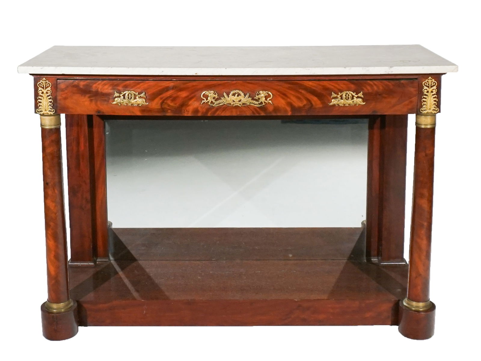 Empire Ormolu Mounted Acajou and Mottled White Marble Top Console Table, Early 19th Century, Height:: Empire Ormolu Mounted Acajou and Mottled White Marble Top Console TableEarly 19th CenturyThe marble top above a long frieze drawer.Property from the Lorraine N. Tyler TrustHeight: 35-1/4 in (89.5 cm);