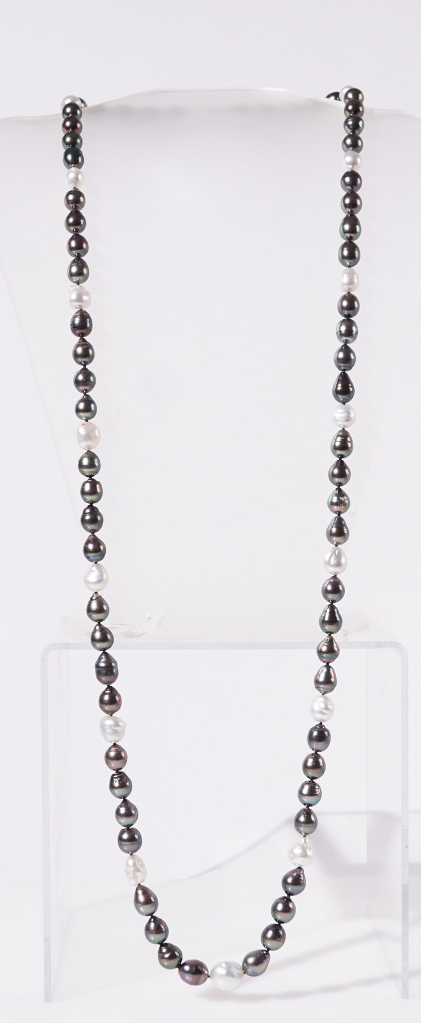 18-Karat White-Gold, Baroque Pearl and Diamond Necklace, Length: 39 in (99 cm): 18-Karat White-Gold, Baroque Pearl and Diamond NecklaceThe single strand having eighty-one Baroque Tahitian and white pearls measuring approximately 9 to 13.4 mm; attached by a polished white-gold and