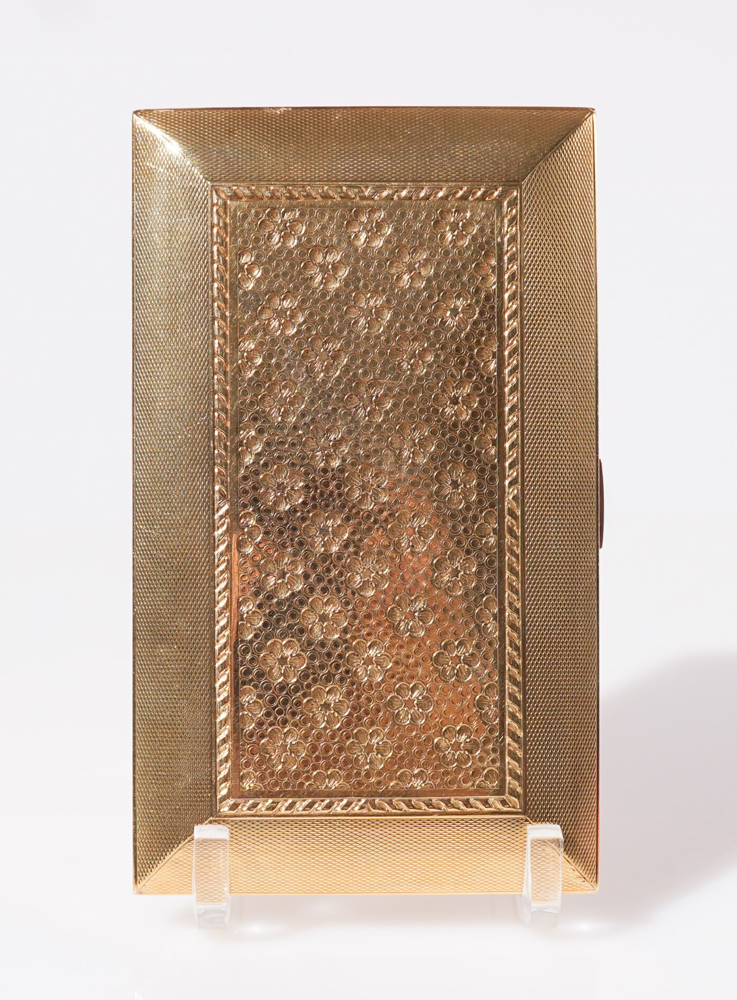 French 18-Karat Yellow-Gold Necessaire, Weight without mirror: 339 dwt., Length: 5-7/8 in (14.9 cm),: French 18-Karat Yellow-Gold NecessaireEarly 20th Century Having a rectangular body with a central panel of chased floral rosettes framed within an engine-turned border; the hinged lid opening to view