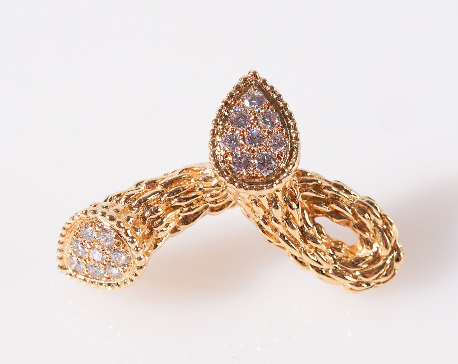 Boucheron 18-Karat Yellow-Gold and Diamond Brooch, Gross weight: 8.8 dwt., Length: 1-1/4 in (3.1 cm): Boucheron 18-Karat Yellow-Gold and Diamond Brooch Set with sixteen round brilliant-cut diamonds weighing approximately .55 carats. Signed and numbered A993917. Gross weight: 8.8 dwt. Length: 1-1/4 in 