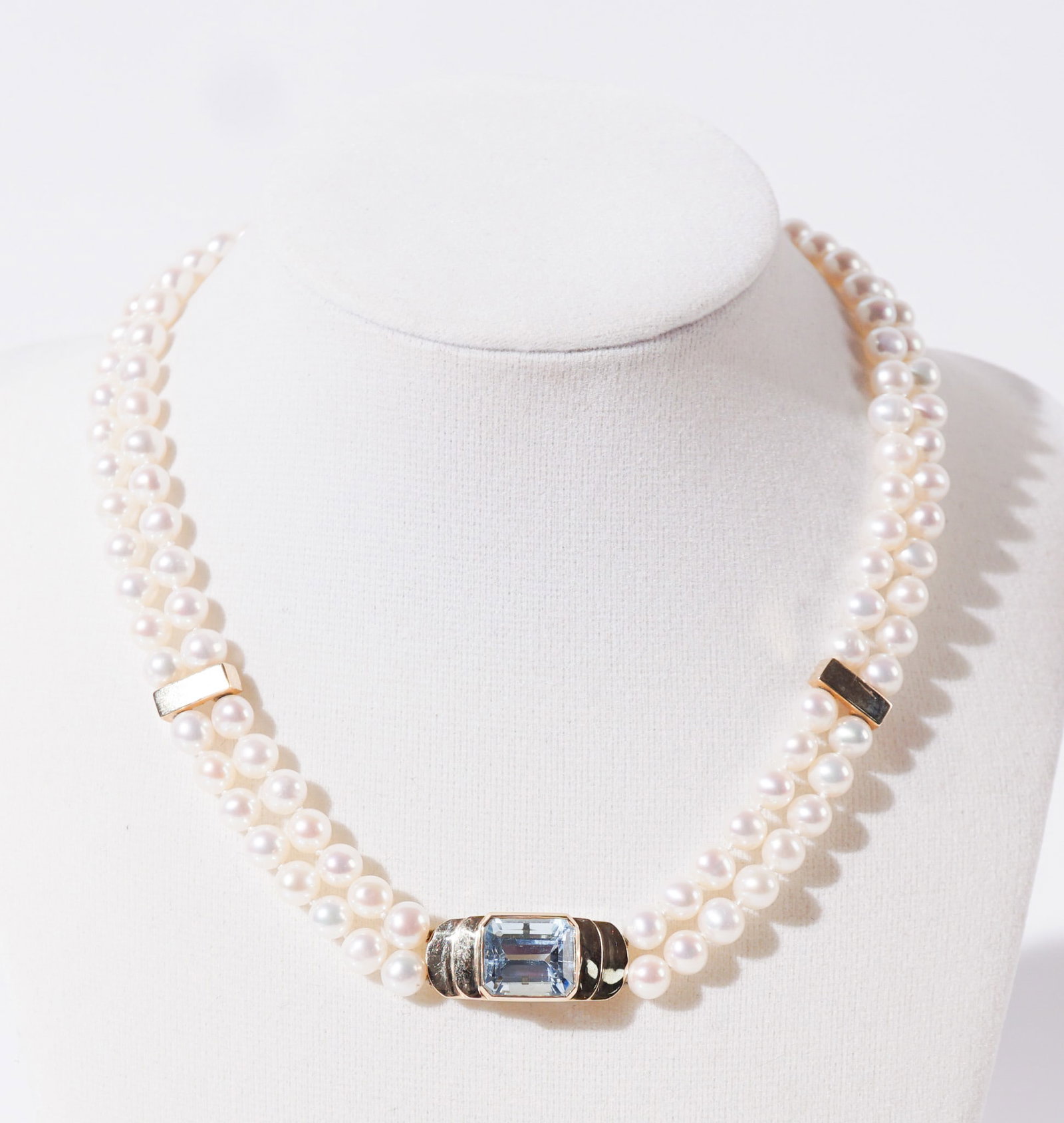 14-Karat Yellow-Gold, Blue Topaz and Pearl Necklace, Length: 15 in (38.1 cm): 14-Karat Yellow-Gold, Blue Topaz and Pearl Necklace The double-strand having one hundred twelve pearls measuring approximately 5.9 to 6.1 mm, centered with one cut-corner emerald-cut blue topaz weighi