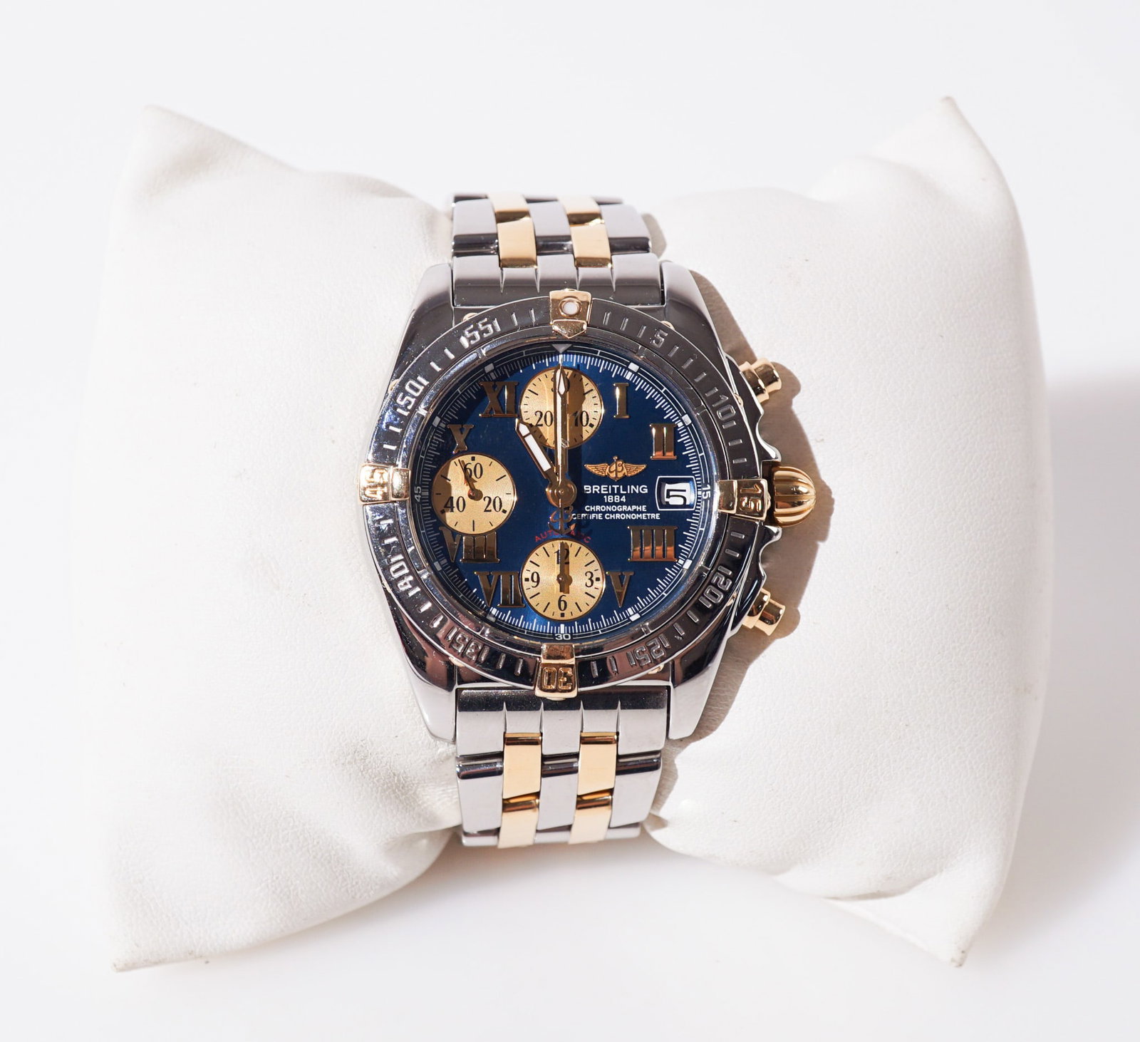 Breitling Chrono Cockpit Stainless Steel and Yellow-Gold Automatic Wristwatch, Diameter: 39 mm,: Breitling Chrono Cockpit Stainless Steel and Yellow-Gold Automatic Wristwatch Reference number B13358Having a round blue dial with gold tone Roman hour chapters, date lens and three subsidiary dials; 