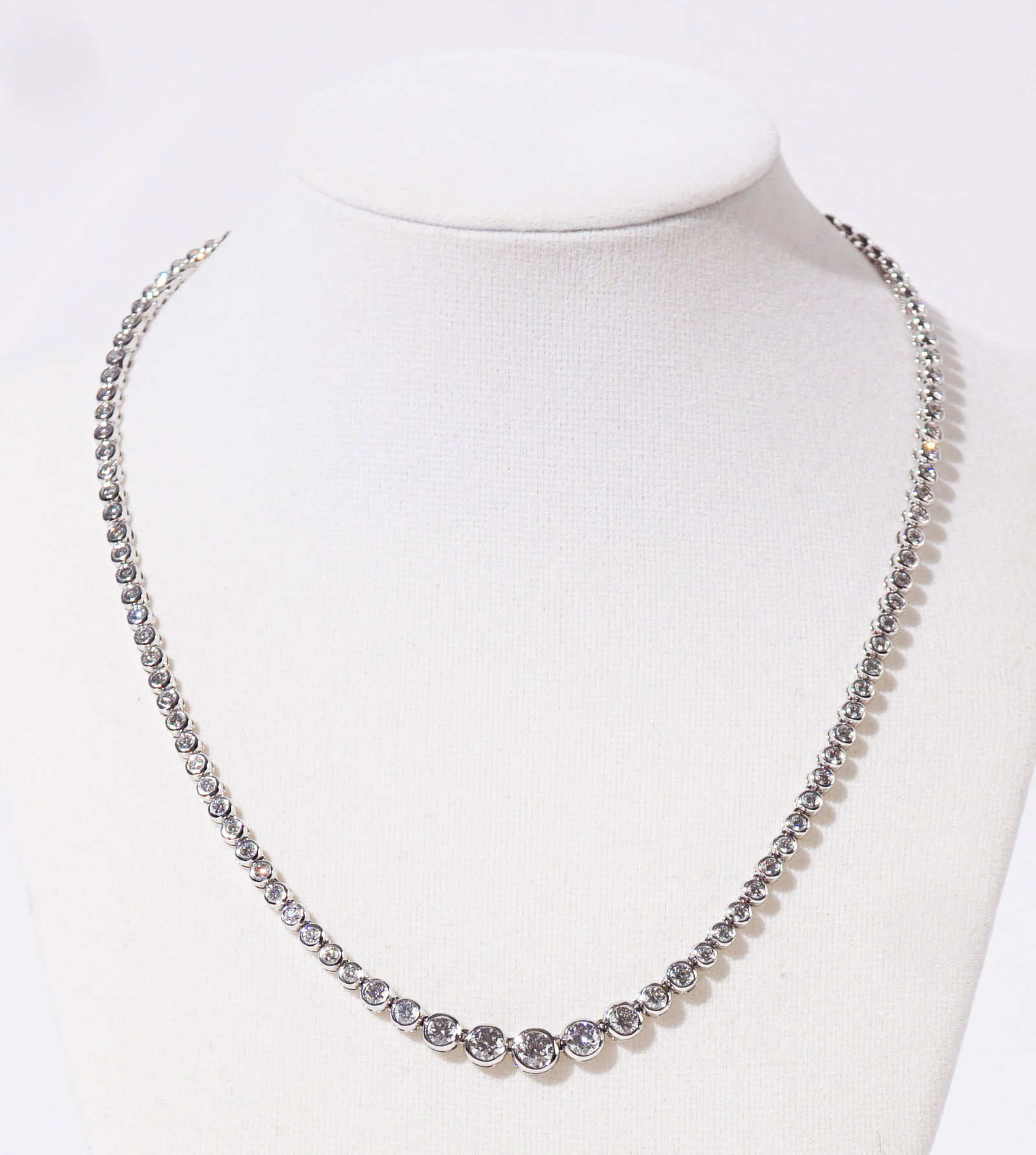 14-Karat White-Gold and Diamond Rivière Necklace, Gross weight: 12.2 dwt., Length: 17-1/8 in: 14-Karat White-Gold and Diamond Rivière Necklace Set with one hundred thirteen round brilliant-cut diamonds weighing approximately 6.20 carats. Gross weight: 12.2 dwt. Length: 17-1/8 in (43.5 cm)