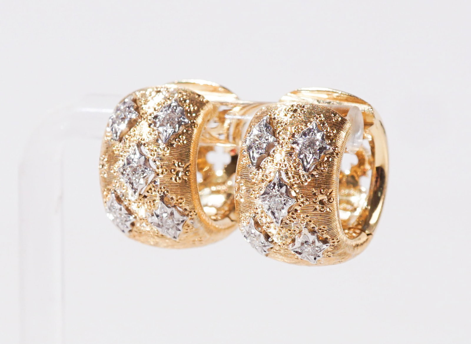 Pair of Italian 18-Karat Yellow-Gold and Diamond Hoop Pierced Earrings, Total weight of diamonds:: Pair of Italian 18-Karat Yellow-Gold and Diamond Hoop Pierced Earrings Each set with five round brilliant-cut diamonds weighing approximately .10 carats. Total weight of diamonds: .20 carats Total gro