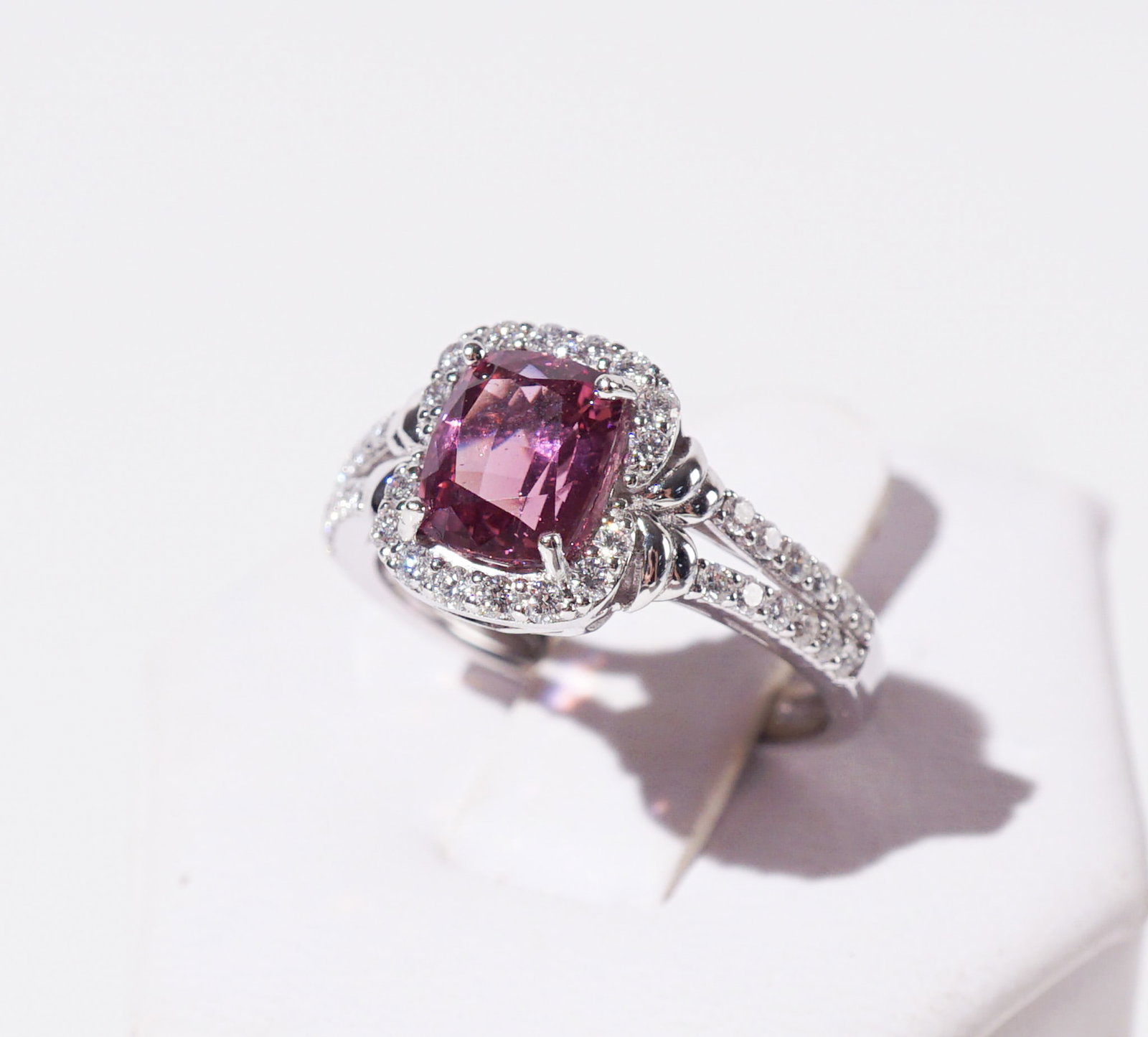Oscar Friedman Platinum, Spinel and Diamond Ring, Shank size: 6-3/4: Oscar Friedman Platinum, Spinel and Diamond Ring Set with one cushion-cut purple-pink spinel weighing 2.09 carats, surrounded by a pavé of round brilliant-cut diamonds weighing approximately .45 