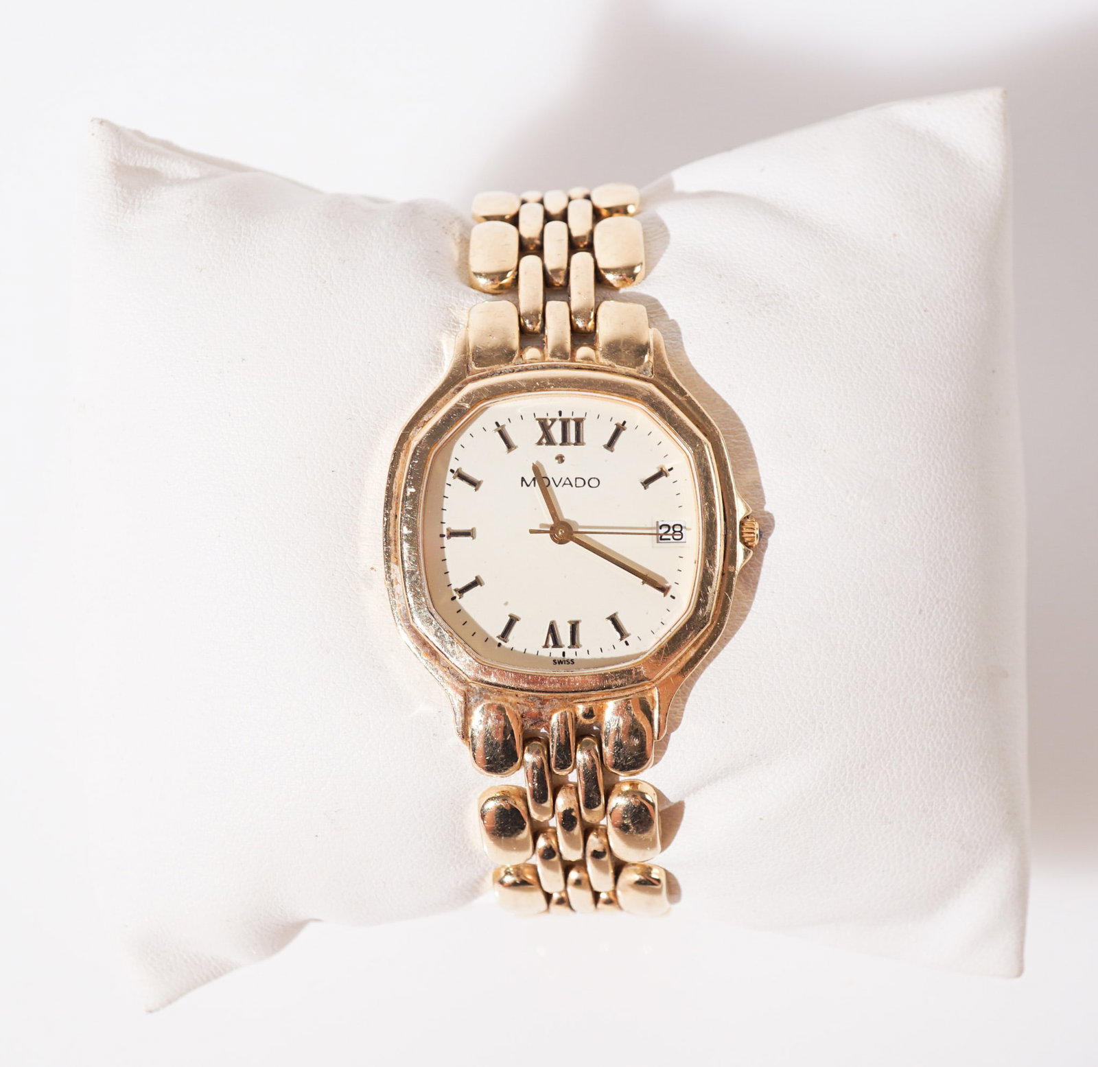 Movado 14-Karat Yellow-Gold Quartz Wristwatch, Gross weight: 40.9 dwt., Length approximately: 7 in: Movado 14-Karat Yellow-Gold Quartz Wristwatch Numbered 745299878/ 828064Having a cream-gold octagonal dial with raised gold-tone line and Roman hour chapters and date aperture; attached by a 14-karat 
