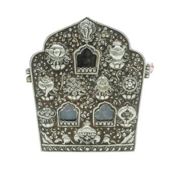 Large Tibetan Repoussé Silvered Metal Tri-Amulet Container with Painted Composition TsaTsa (Ghau: Large Tibetan Repoussé Silvered Metal Tri-Amulet Container with Painted Composition TsaTsa (Ghau) 19th-Early 20th Century Contained within a blue, gold and red brocade silk hinged carrying case with 