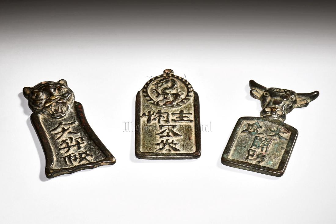 THREE BRONZE CAST MEDALLIONS (1 of 8)