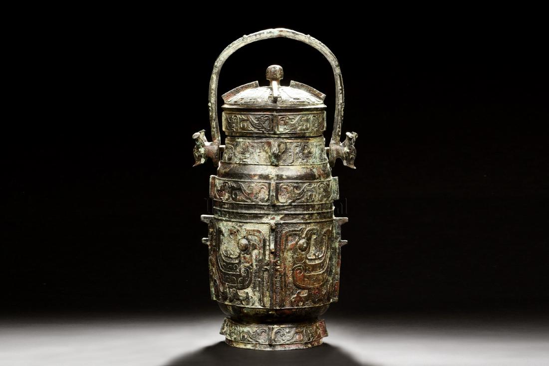 ARCHAIC BRONZE CAST RITUAL VESSEL WITH HANDLE AND LID (1 of 9)