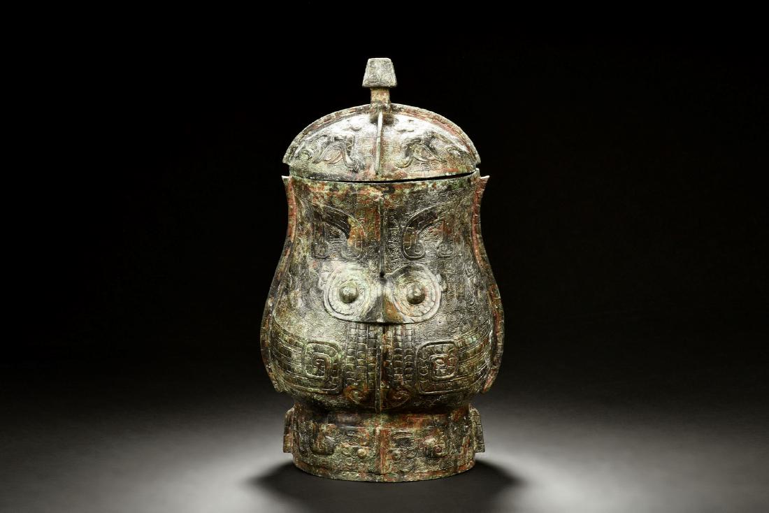 ARCHAIC BRONZE CAST 'BEAST' RITUAL VESSEL, ZHI (1 of 10)