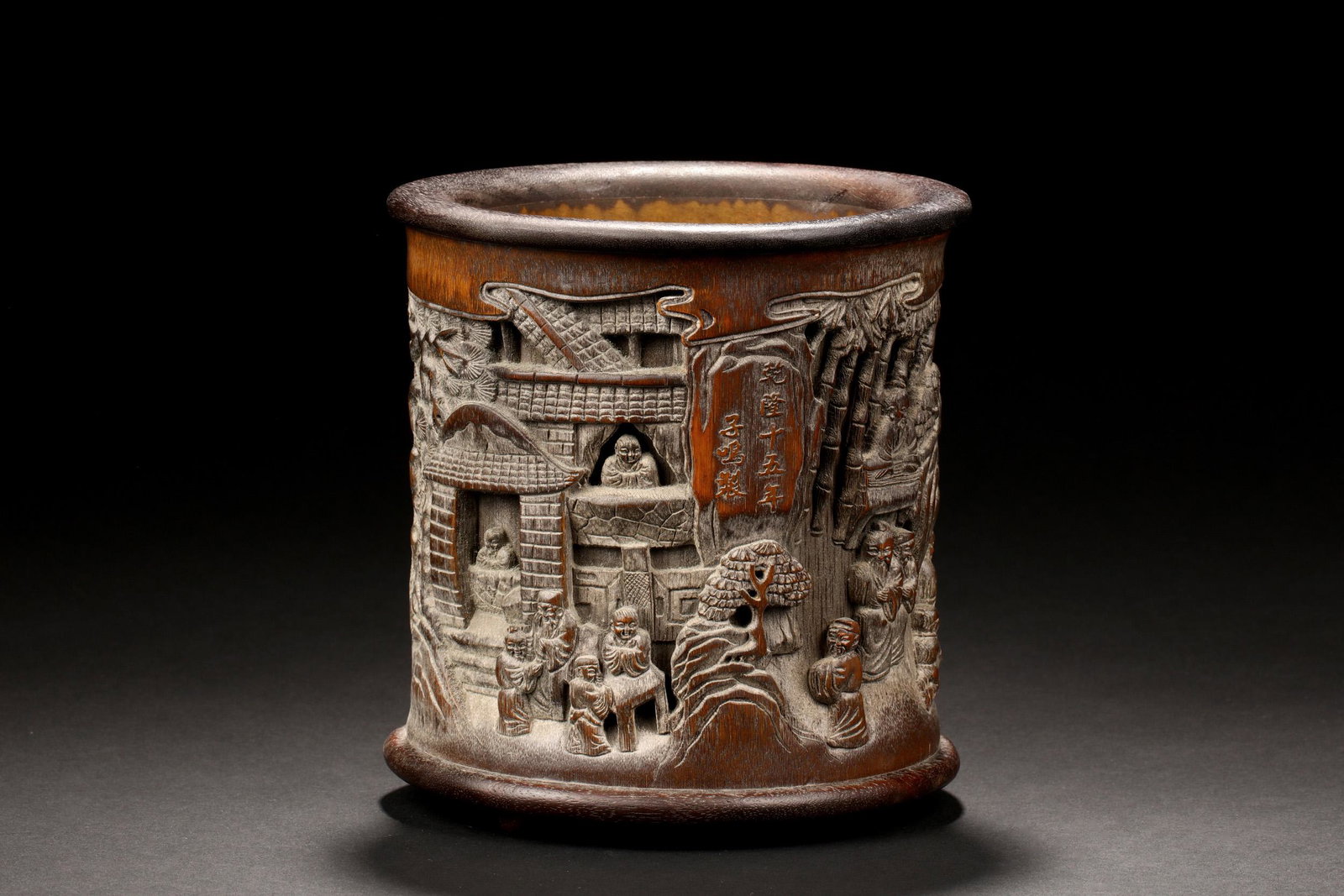 BAMBOO RELIEF CARVED 'BAMBOO GROVE' BRUSH POT: 竹雕竹林七賢筆筒 The cylindrical brush pot relief carved on the exterior depicting scholars, elders, and attendants engaged in leisurely activities unde