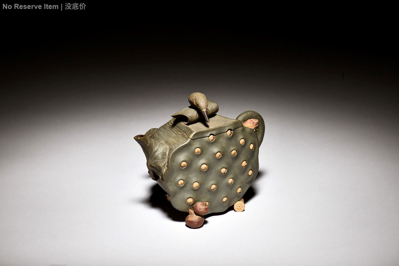YIXING ZISHA 'LOTUS POD' TEAPOT: 紫砂蓮蓬茶壺 The Yixing Zisha teapot is of lotus pod form, with naturalistic design, decorated with water chestnuts, lotus seeds, lotus root, and small bird, the cl
