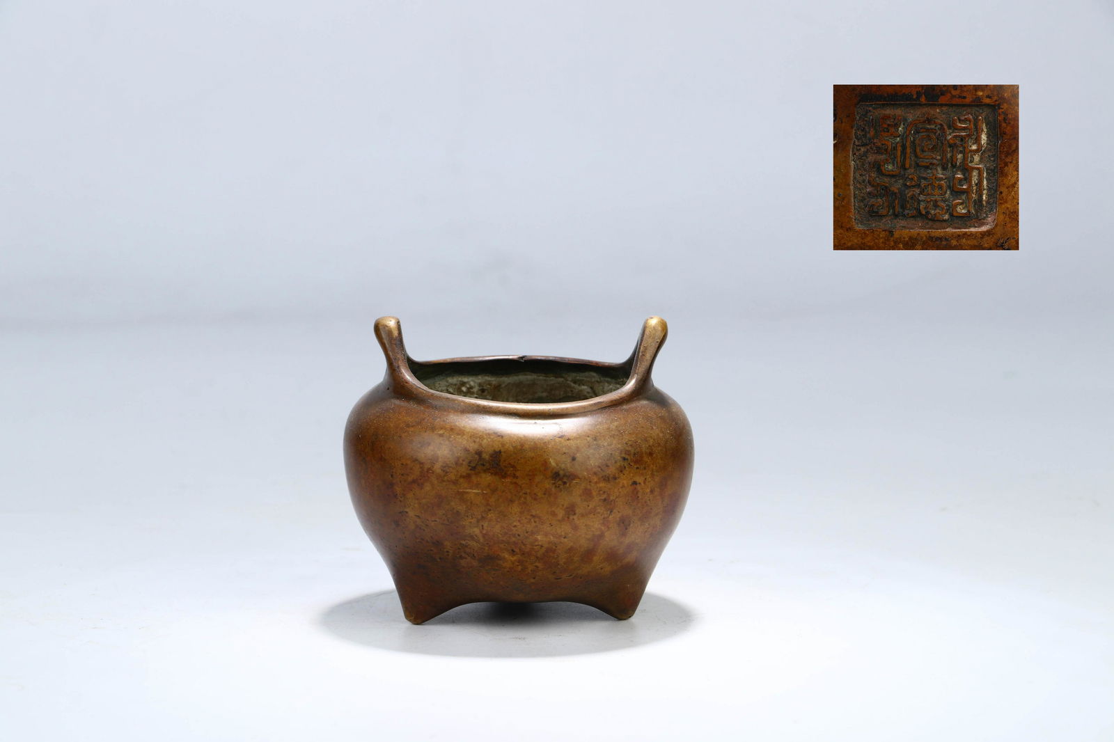 A CHINESE COPPER THREE-LEGGED INCENSE BURNER (1 of 9)