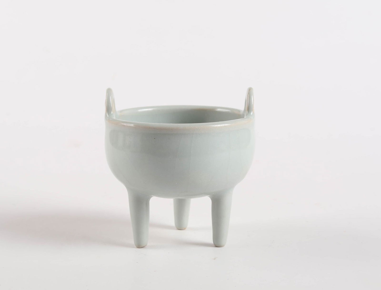 A CHINESE LONGQUAN PORCELAIN THREE-LEGGED INCENSE (1 of 5)