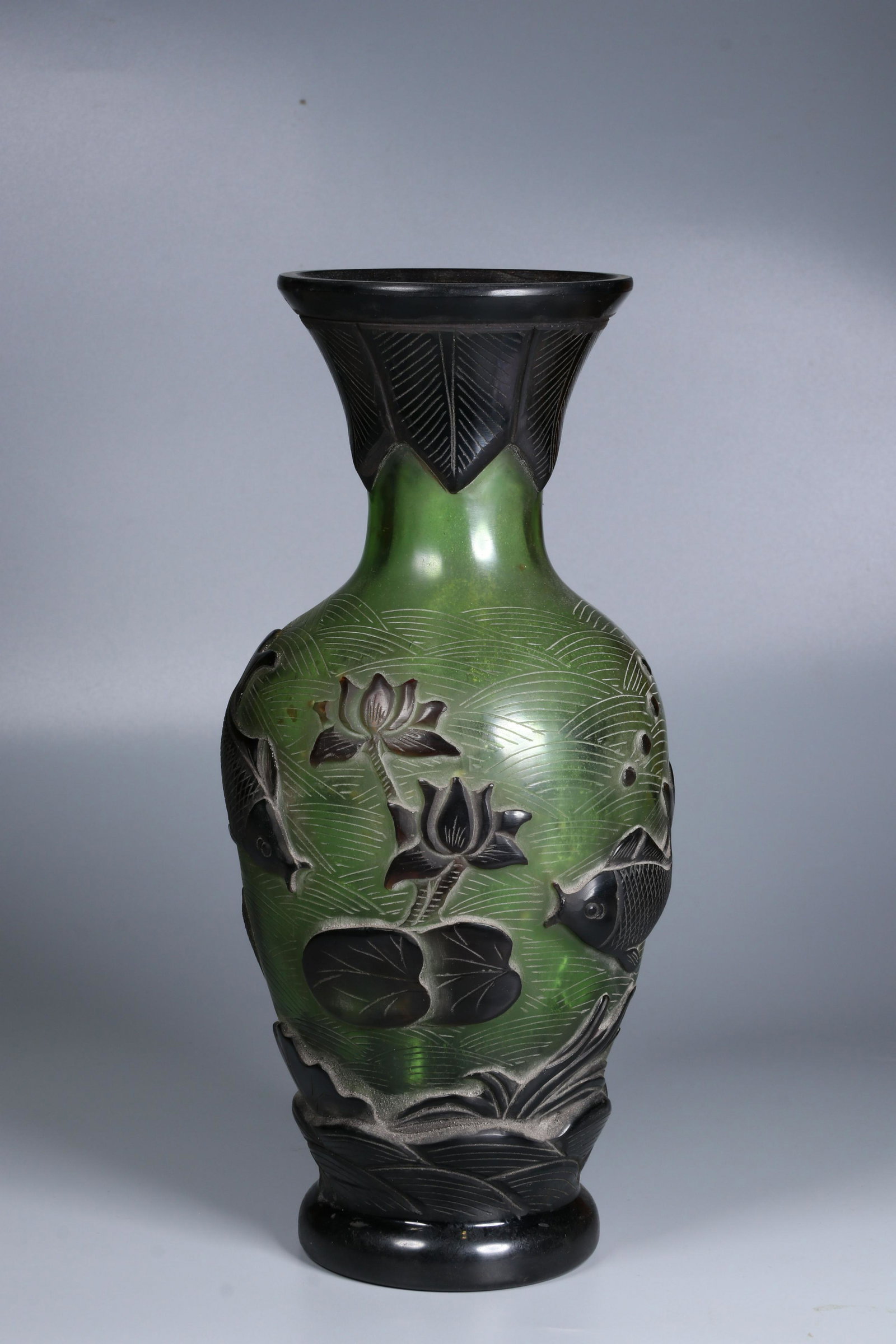 GREEN GLASS OVERLAY 'POND SCENERY' VASE: 民国乾隆年制款琉璃瓶 Green glass overlay 'Pond Scenery' vase Height: 10 3/4 in (27.0 cm) Diameter: 4 3/8 in (11.0 cm)