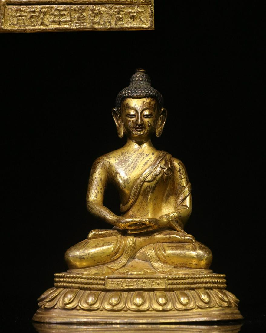 GILT BRONZE CAST 'SHAKYAMUNI' SEATED FIGURE (1 of 9)