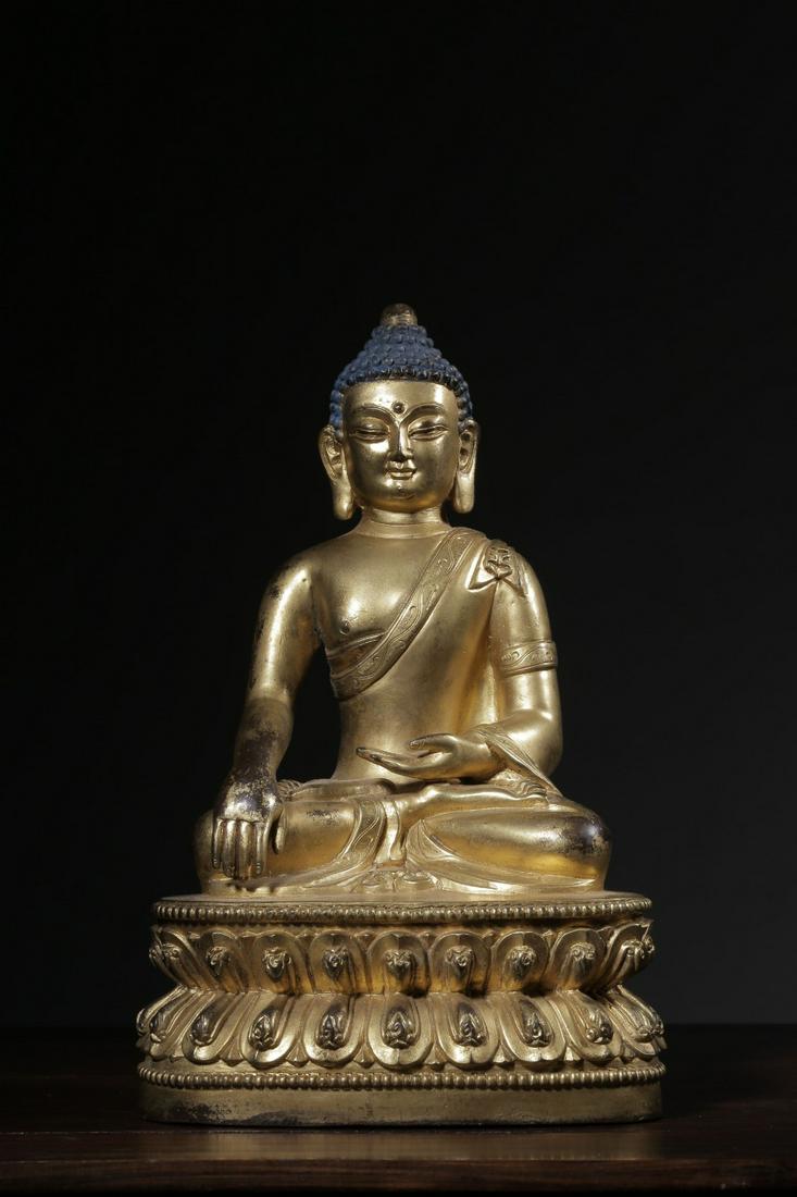 GILT BRONZE CAST 'SHAKYAMUNI' SEATED FIGURE (1 of 9)