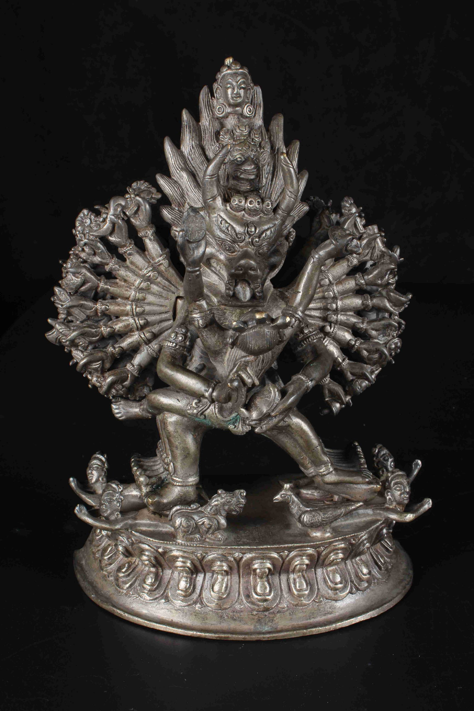 A CHINESE SILVERING BRONZE BUDDHA STATUE: 银千手佛 A Chinese Silvering Bronze Buddha Statue Height: 7 7/8 in (20.0 cm) Width: 5 5/8 in (14.0 cm) Weight: 1543.1g