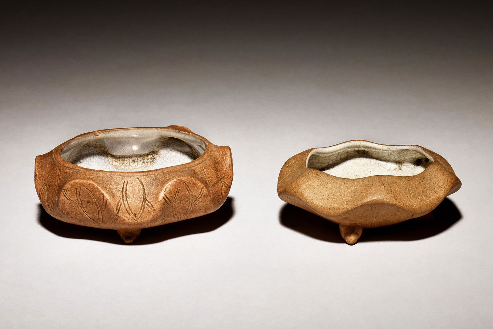 TWO YIXING ZISHA COMPRESSED TRIPOD JARS (1 of 6)