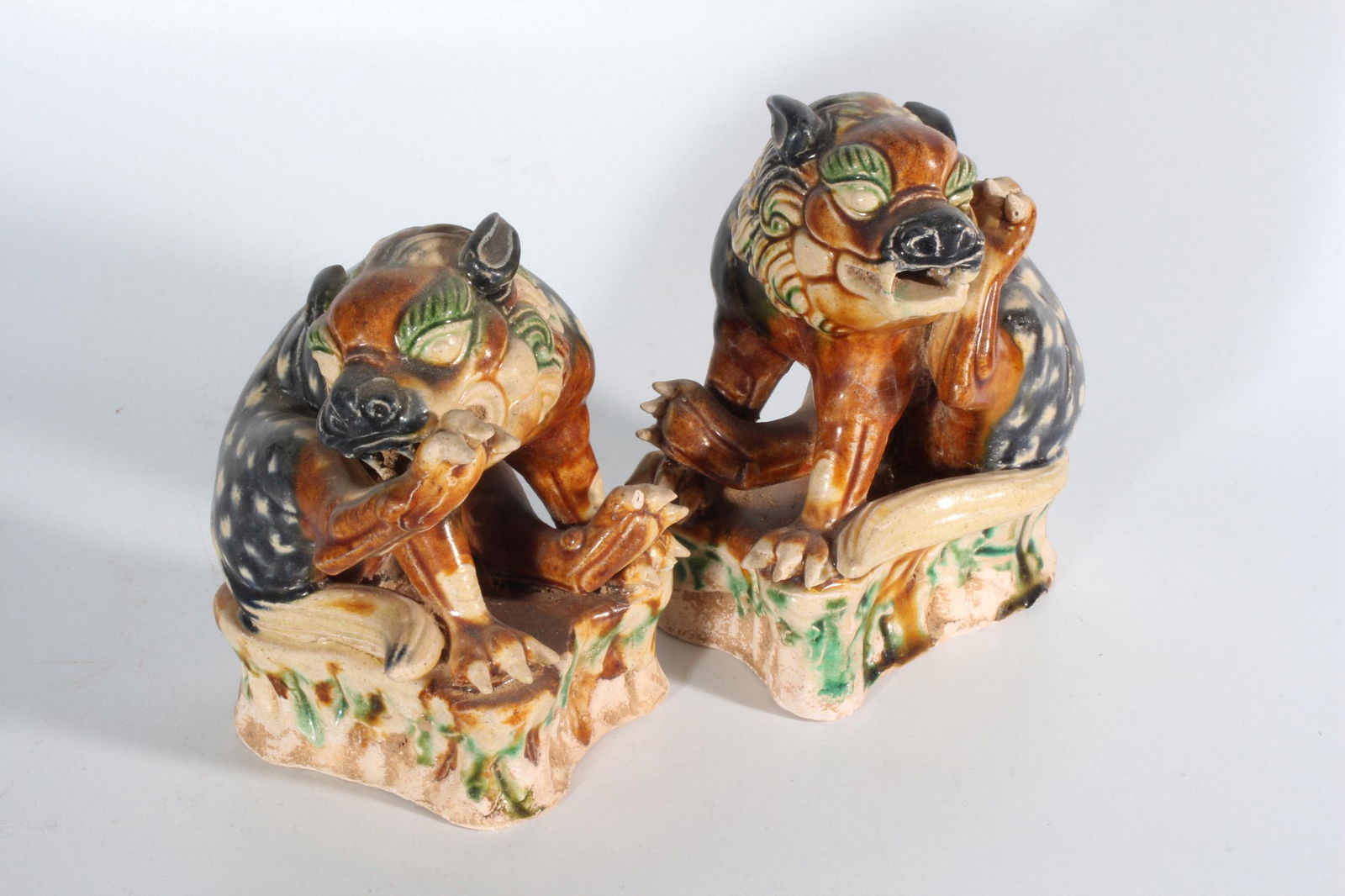 PAIR OF SANCAI GLAZED 'LIONS' FIGURES (1 of 8)