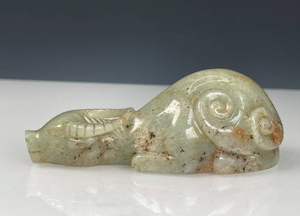 JADE CARVED 'WATER BUFFALO' ORNAMENT: 玉牛 Jade carved 'Water Buffalo' ornament Height: 1 1/2 in (3.5 cm) Length: 3 3/8 in (8.5 cm) Width: 1 3/8 in (3.3 cm)